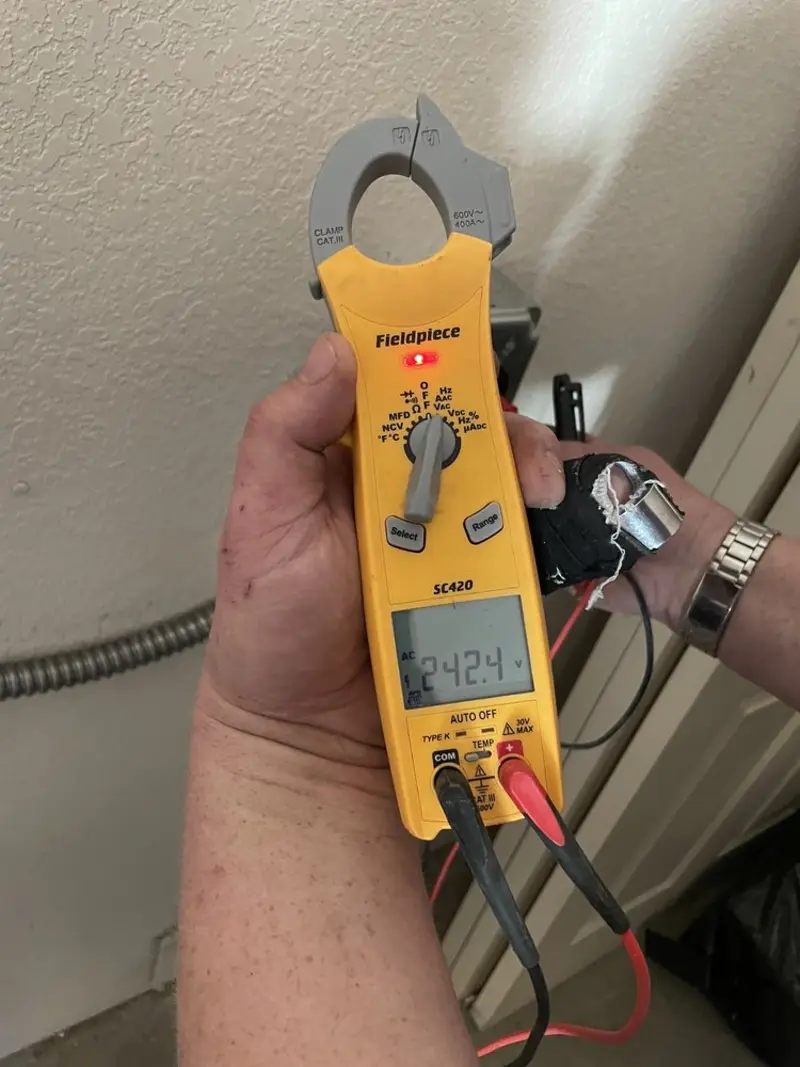 Voltage testing with clamp meter during Outlet Installation in Happy Valley